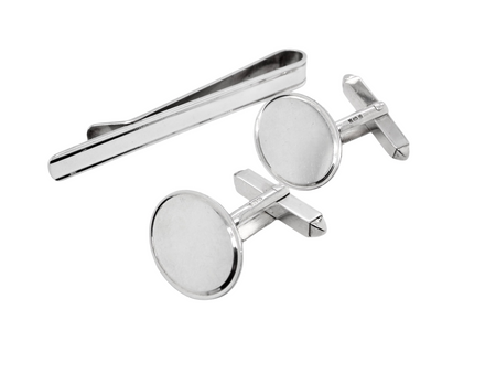 A sterling silver set. Consisting of a pair of plain oval shaped cufflinks. Head 17x13mm, torpedo fittings. Hallmarks for Birmingham 1994.