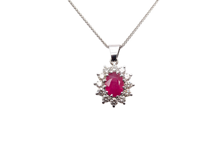 A striking and elegant pendant crafted in 18-carat white gold, showcasing a vibrant oval-cut ruby of approximately 2.00 carats 