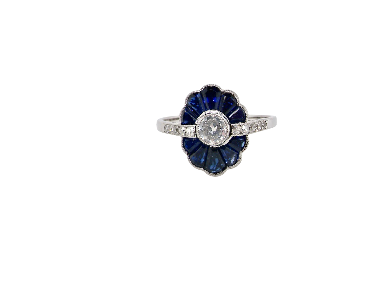 A striking and highly unusual Art Deco cluster ring featuring a distinctive fan-shaped design.