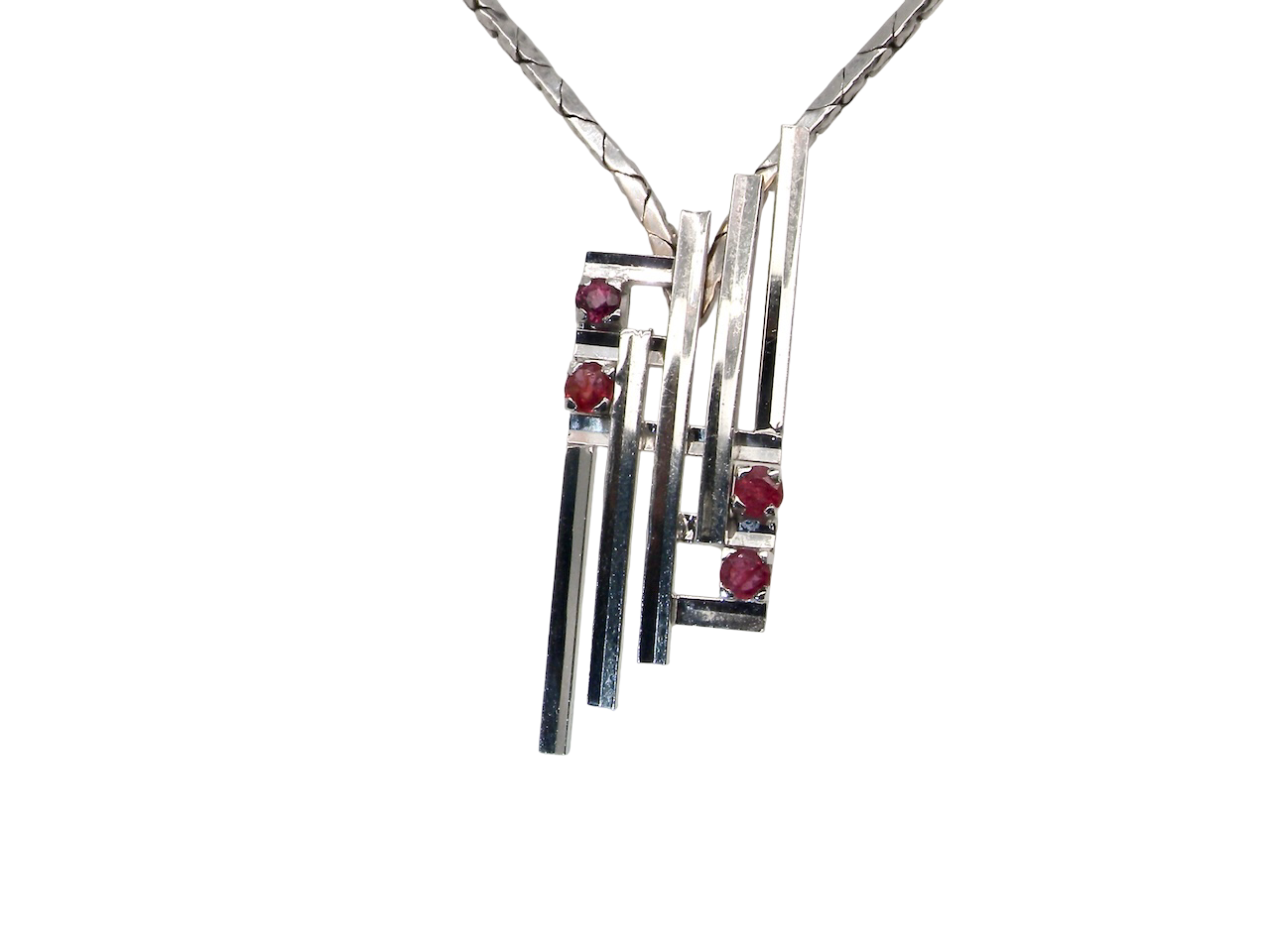A striking modern pendant set with four 3mm rubies. The pendant measures approximately 40mm x 14mm and features a sleek design of horizontal bars, with the outer bars each set with vibrant round rubies.