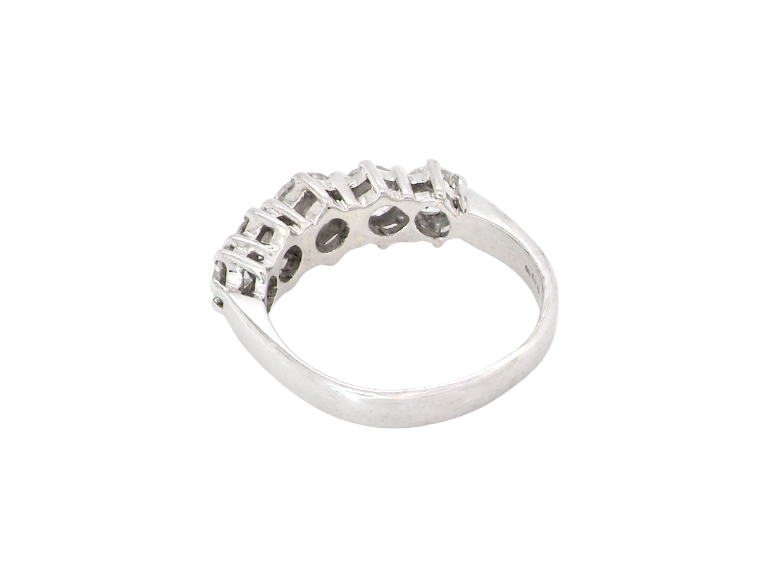 A stunning half hoop ring featuring five exceptional brilliant-cut white diamonds, expertly claw set in 18ct white gold.

The centre diamond measures approximately 5.8mm (estimated 0.70 carats), flanked by a 5.0mm diamond on each side, with 4.5mm diamonds at each end. Rear