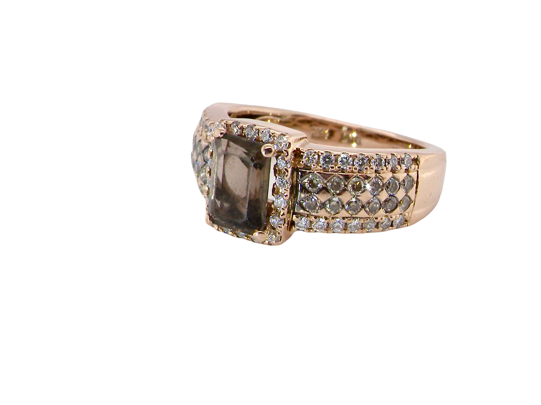 A stunning ring from the House of Le Vien. Crafted from 14ct Strawberry Gold, this Le Vian ring&nbsp; is characterised by a gallery of brown/white diamonds set into each shoulder-side
