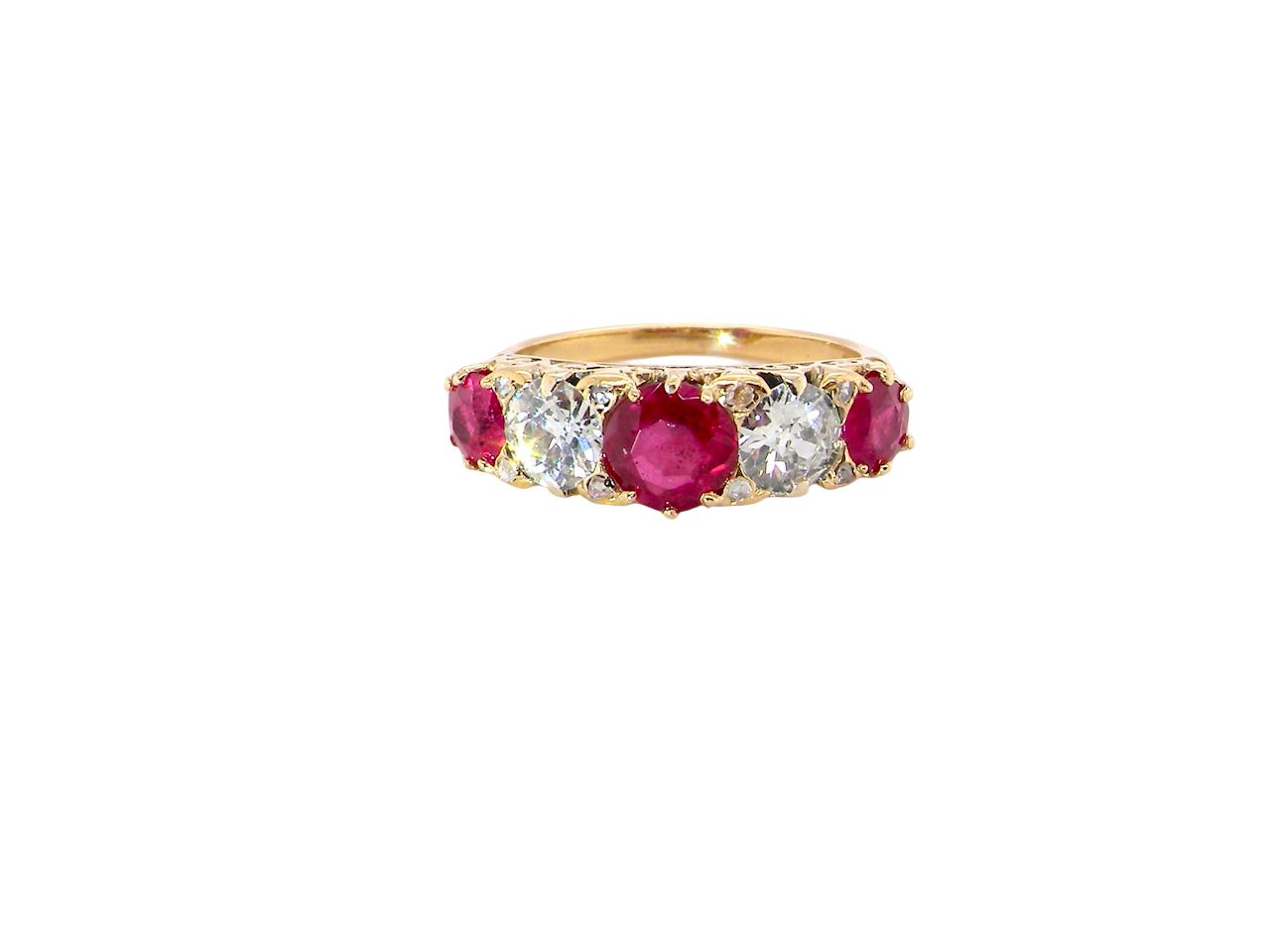 A superb Victorian ring, carved boat shaped head. Set with three fine rubies , 