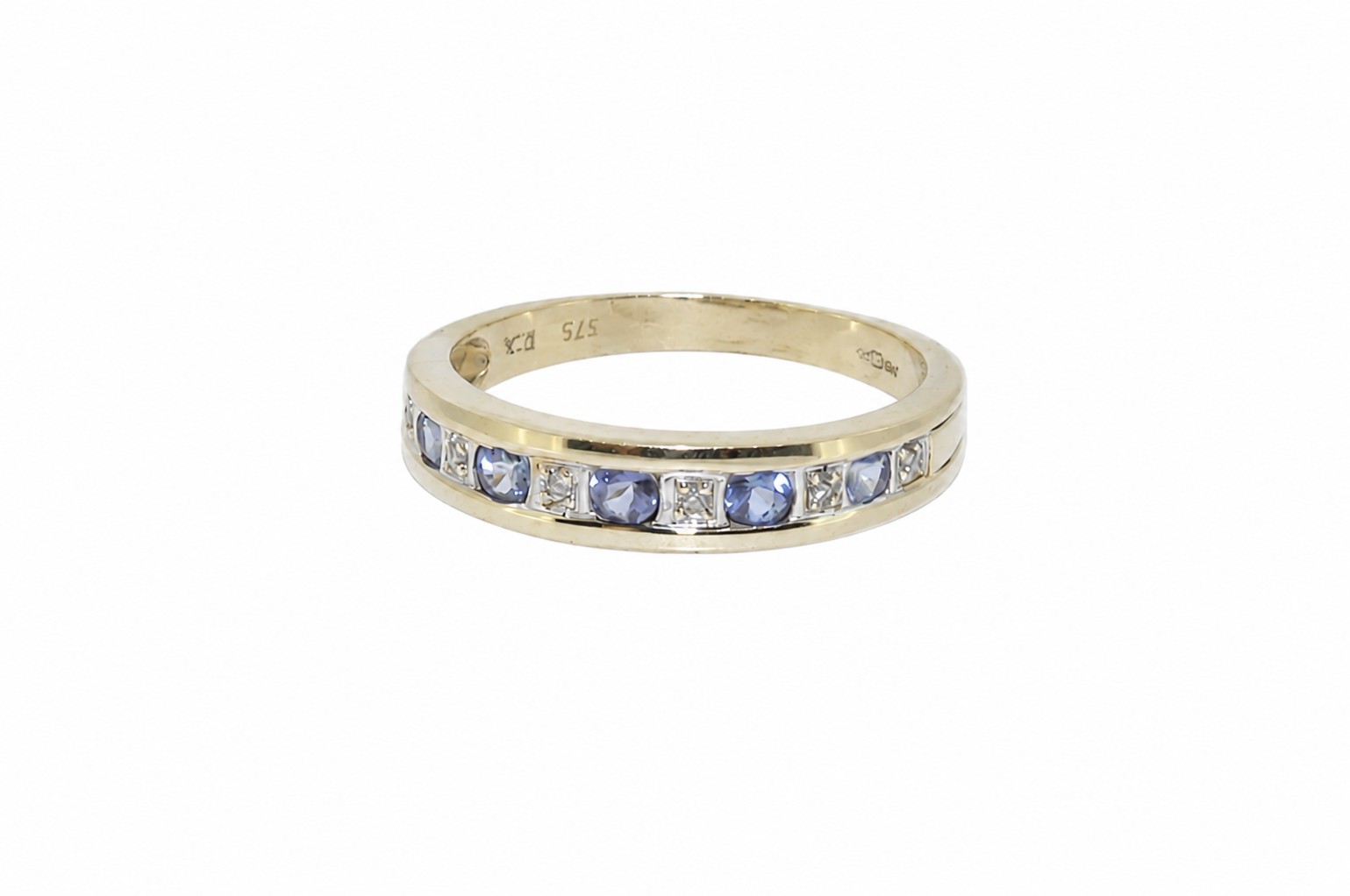 A tanzanite and diamond half eternity ring