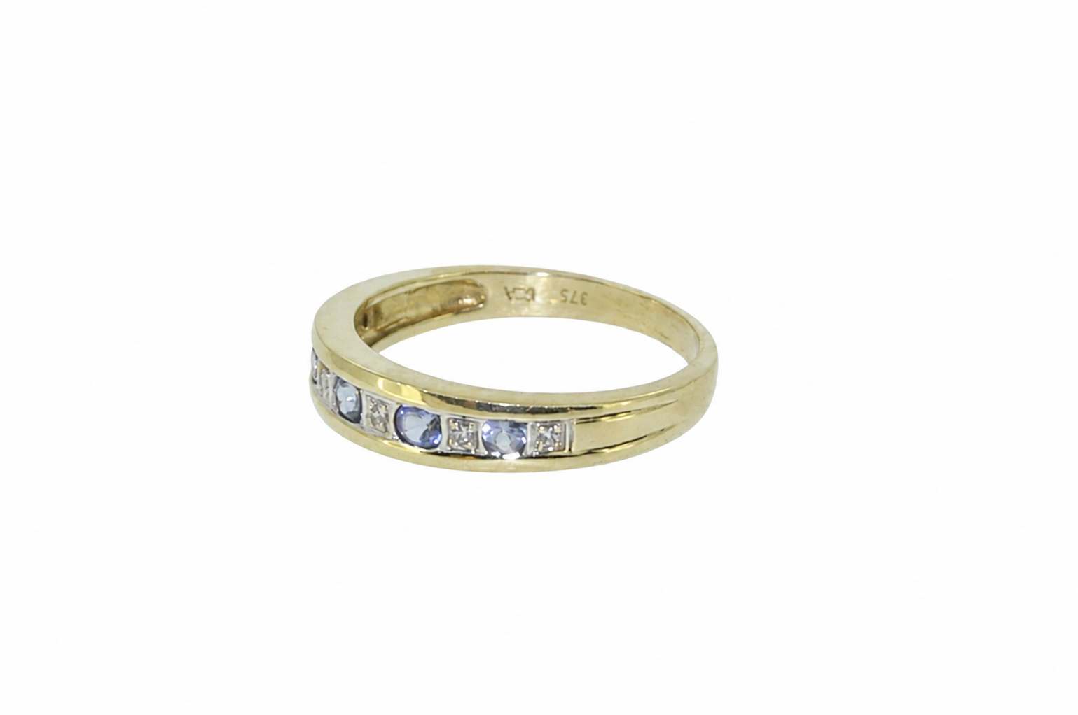 Side view of tanzanite and diamond eternity ring