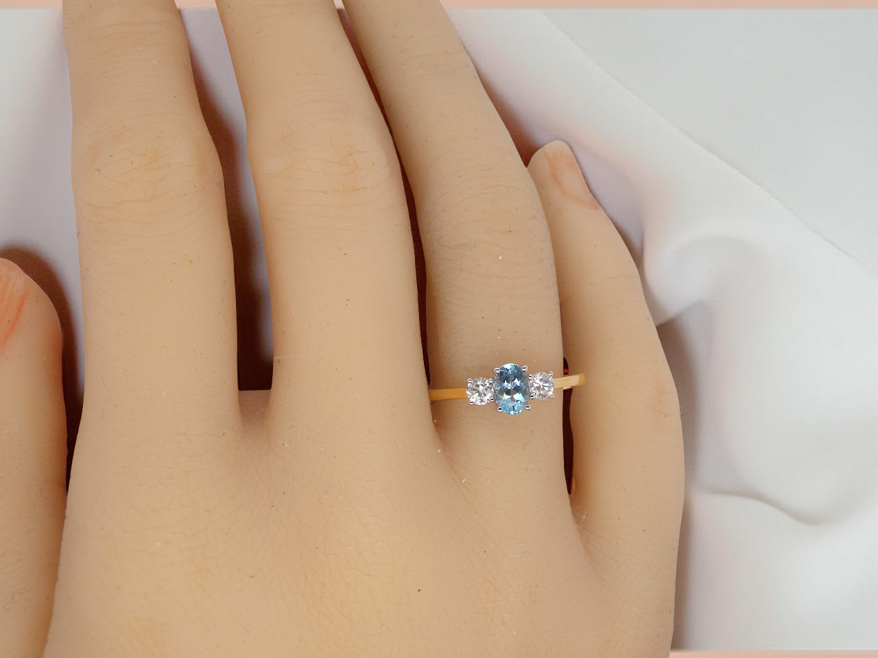 A three stone Aquamarine and Diamond ring