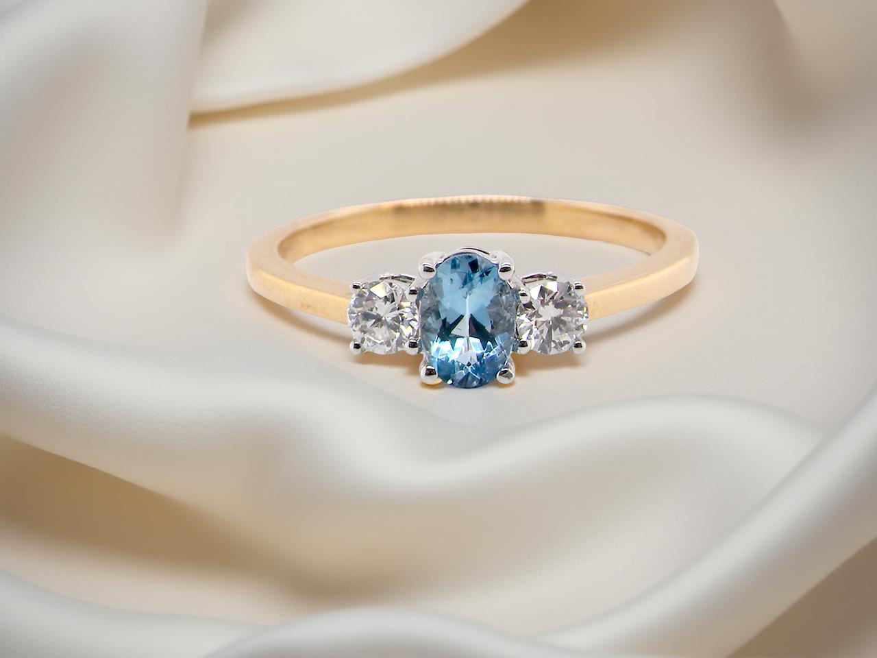 A three stone Aquamarine and Diamond ring