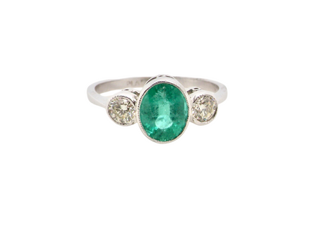 A three stone Emerald and Diamond ring