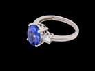 A three stone ring that features an impressive tanzanite centre stone that measures 10x8mm (3.21 carats confirmed) 