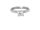 A timeless and beautifully crafted solitaire ring featuring a stunning 0.78 carat Princess-cut white diamond 