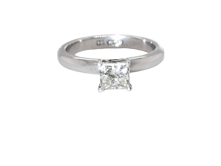 A timeless and beautifully crafted solitaire ring featuring a stunning 0.78 carat Princess-cut white diamond 