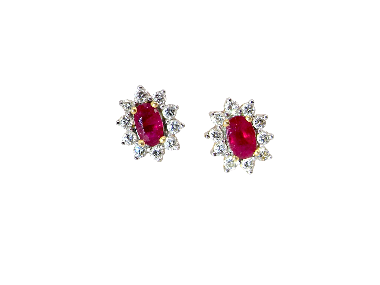 A timeless and elegant pair of ruby and diamond cluster earrings.