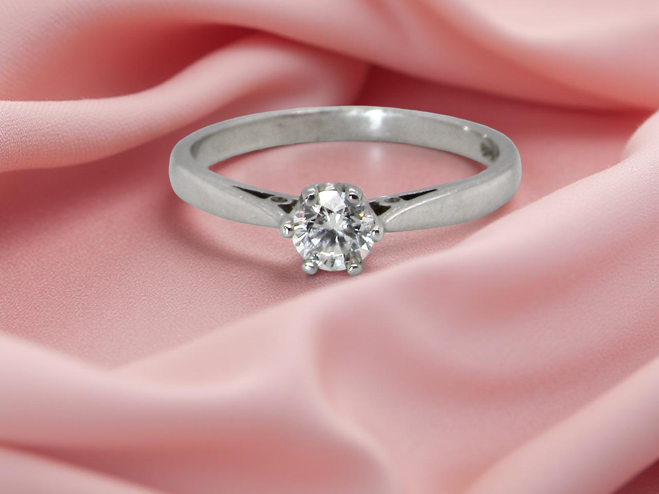 A timeless and elegant solitaire ring set with a white diamond