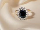 A timeless cluster ring featuring a  sapphire 