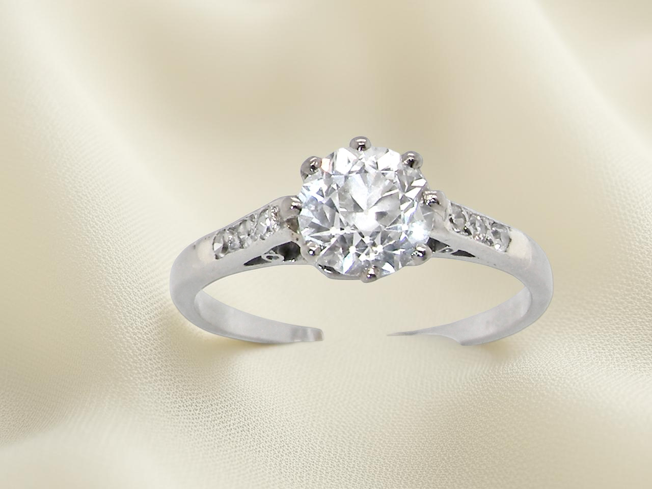 A timeless vintage solitaire ring set with a striking old brilliant cut white diamond. The central diamond measures approximately 6mm, estimated at 0.75 carat, with colour graded between G–I and 