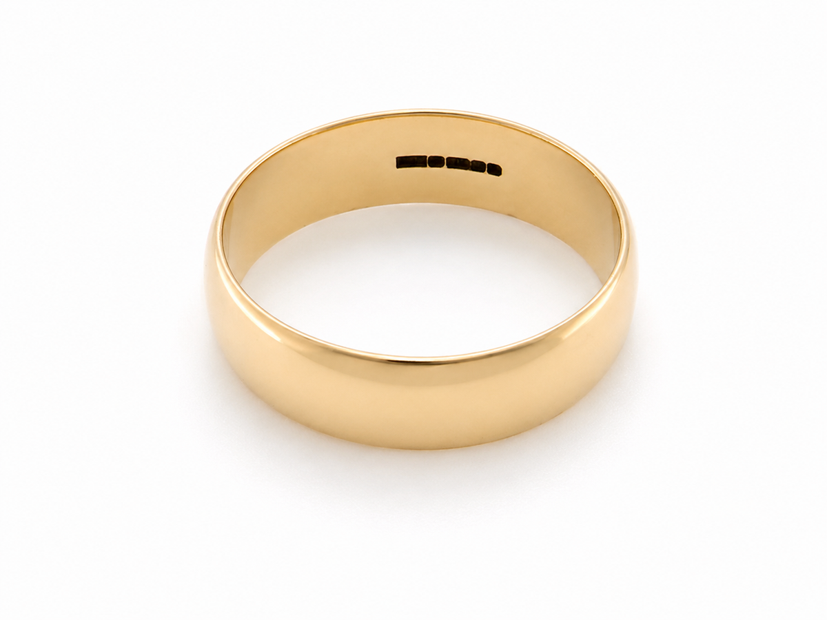 A traditional 9 carat gold wedding ring. A, 