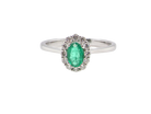 A traditional Emerald & Diamond cluster ring