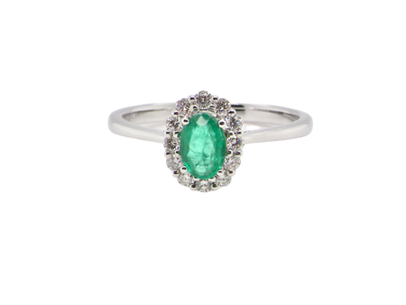 A traditional Emerald & Diamond cluster ring