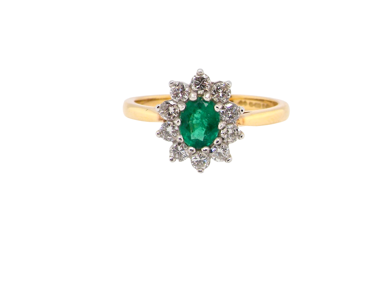 A traditional Emerald and Diamond cluster ring