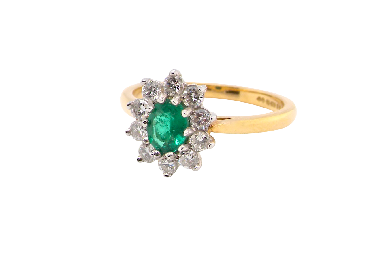 A traditional Emerald and Diamond cluster ring
