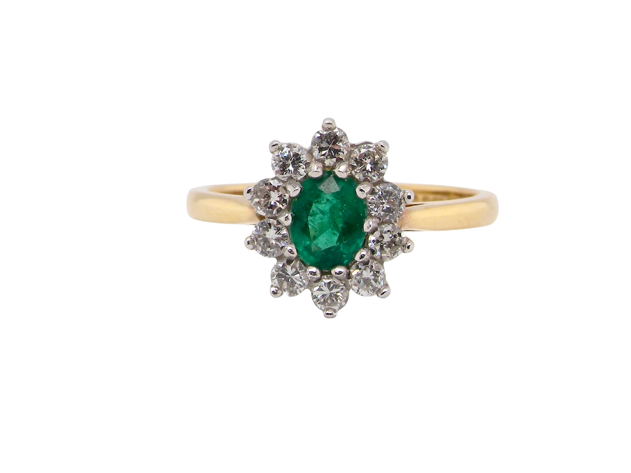 A traditional Emerald and Diamond cluster ring