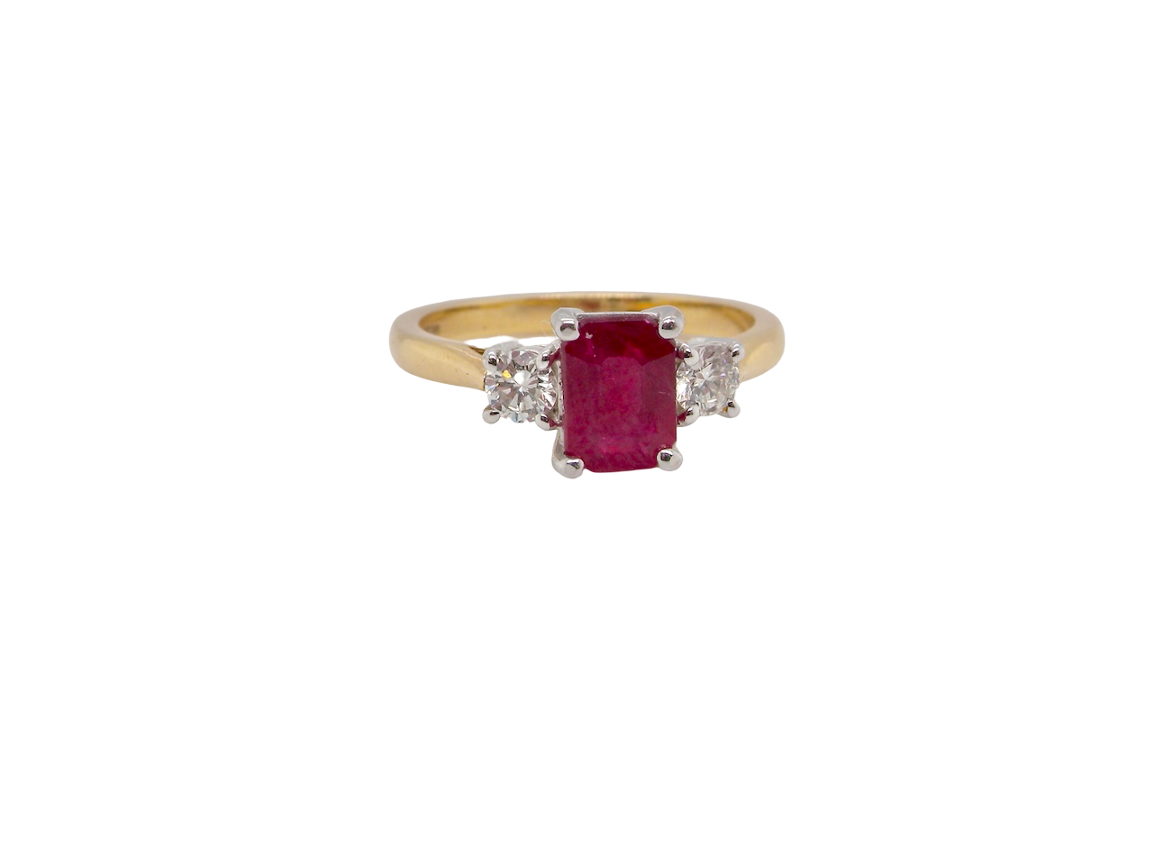 A traditional Ruby and Diamond three stone ring