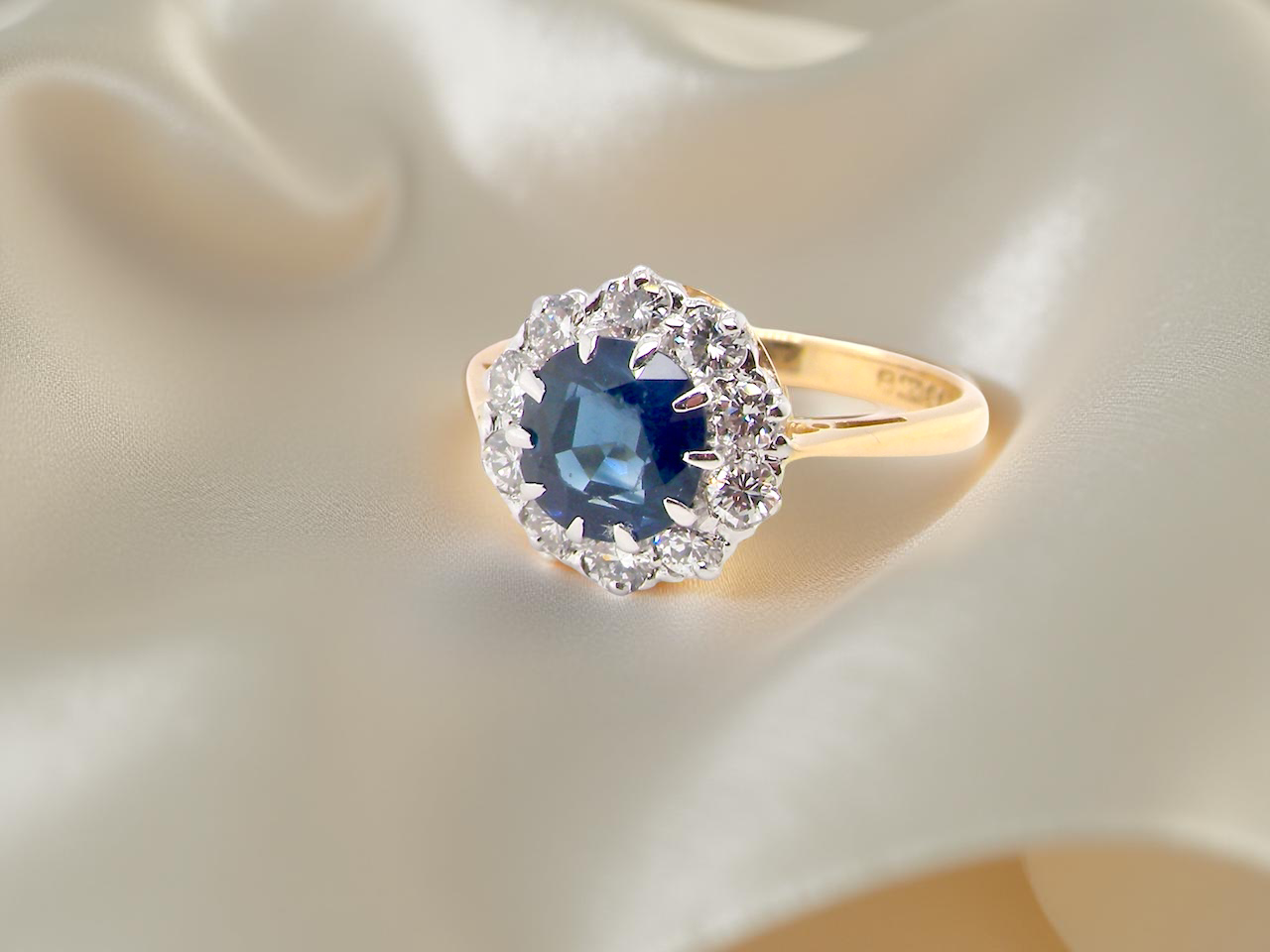 A traditional round cluster- Sapphire and Diamond
