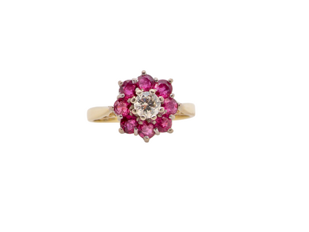 A traditional ruby and diamond cluster ring