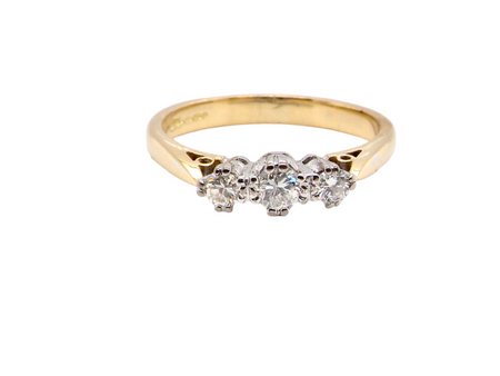 A traditional three stone diamond ring