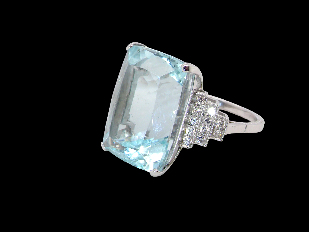 A truly spectacular vintage statement ring, centred with an impressive rectangular-cut aquamarine of exceptional proportions.