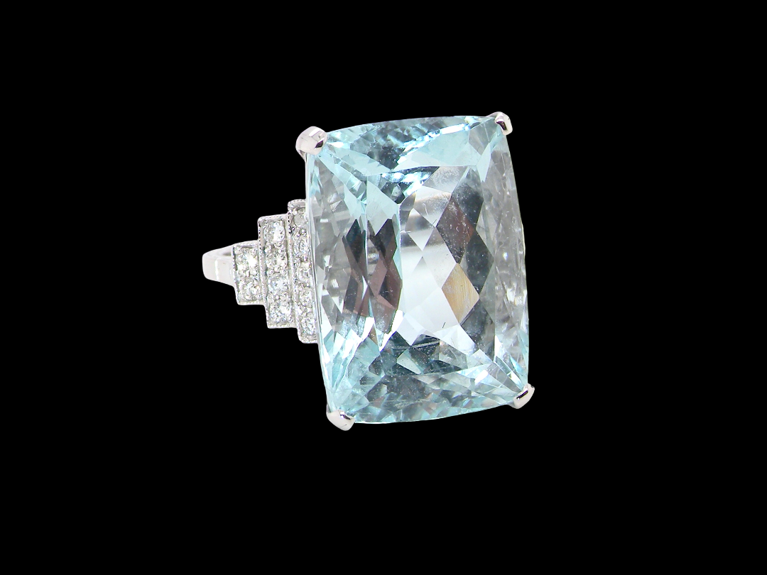 A truly spectacular vintage statement ring, centred with an impressive rectangular-cut aquamarine of exceptional proportions. Measuring approximately&nbsp;18 x 13mm with a depth of 11mm, the aquamarine is estimated at 18 carats 