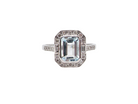 A very pretty cluster ring. Features a step cut aquamarine centre stone, 8x7mm (est 1.21 carats). Plain rim setting.