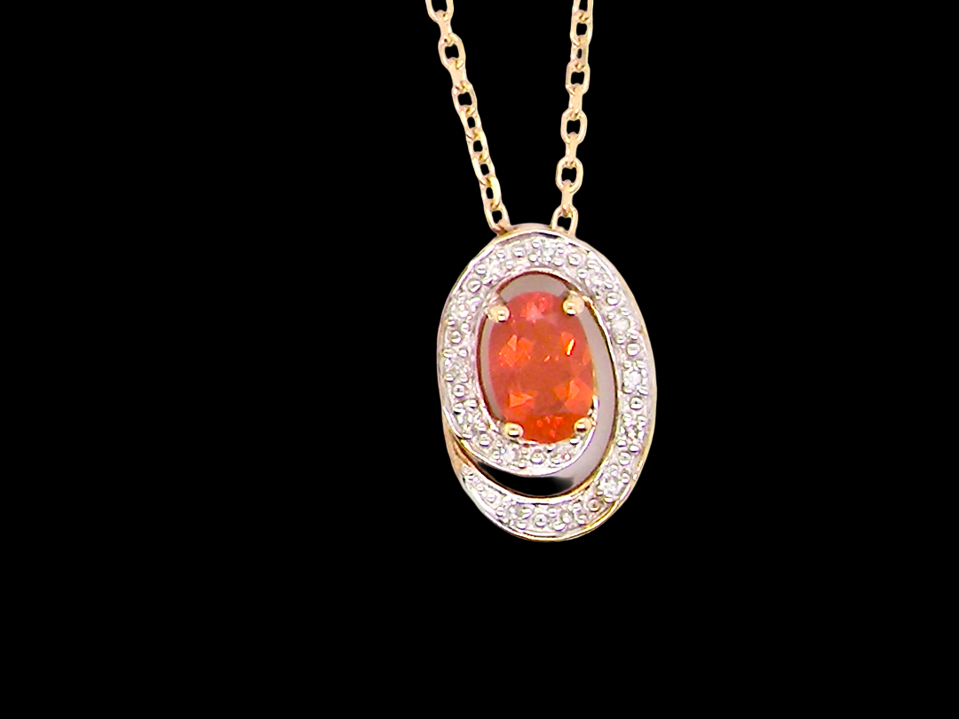 A very pretty pendant set with a fireglow orange Fire Opal.&nbsp; 
