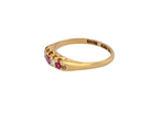 A vintage 18 carat gold three stone ring. Set with brilliant cut white diamonds, cente 3mm, each side a 2.4mm diamond (total est 0.20 carats) Colour I-j, clarity Si.&nbsp;
side