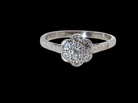 A vintage cluster ring, the head set with seven small single cut white diamonds, 