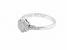 A vintage cluster ring, the head set with seven small single cut white diamonds,  (est 0.15 carats)