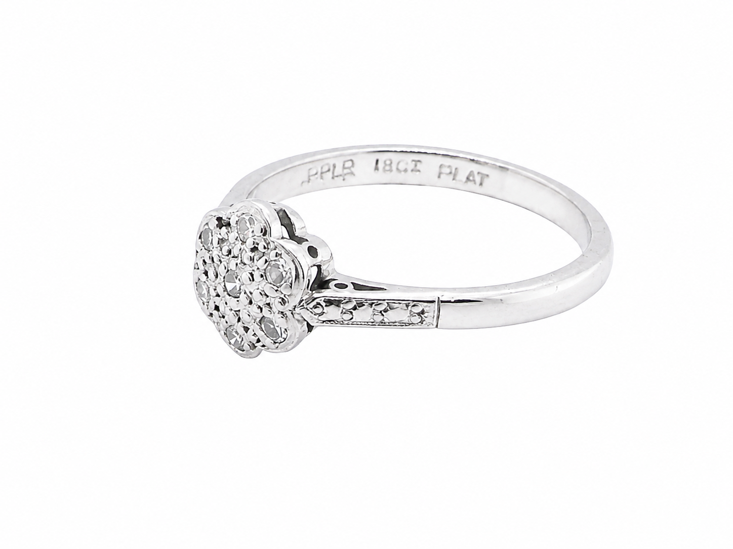 A vintage cluster ring, the head set with seven small single cut white diamonds,  (est 0.15 carats)