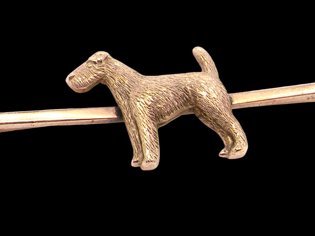 A vintage early 20th century bar brooch. The shape of a dog, possibly an Airdale terrier 