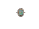 A vintage early 20th century cluster ring. Features to the centre a black opal doublet, with an excellent play of colour, measures 9.5x7.5mm, in a rim setting.
