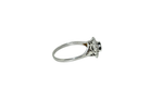 Side view of sapphire and diamond cluster ring