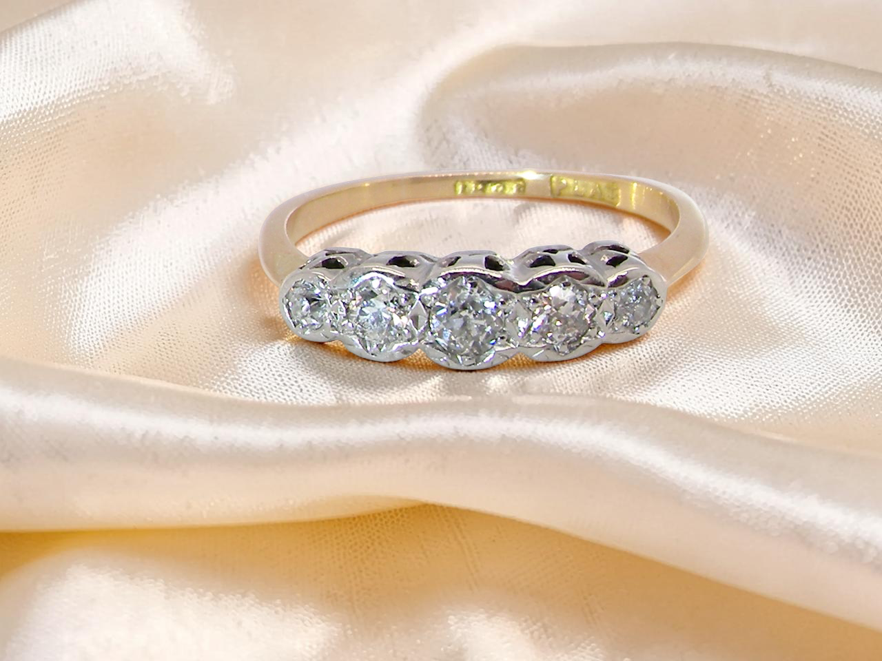 Vintage diamond engagement ring on hand UK