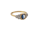 A vintage ring that features to the centre a substantial sapphire and to each side set in platinum three small diamonds. side