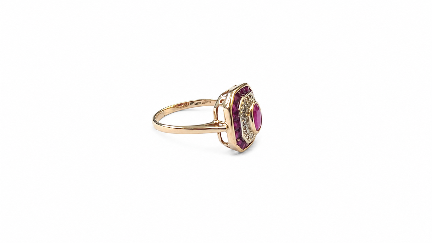 A vintage style ruby diamond cluster ring