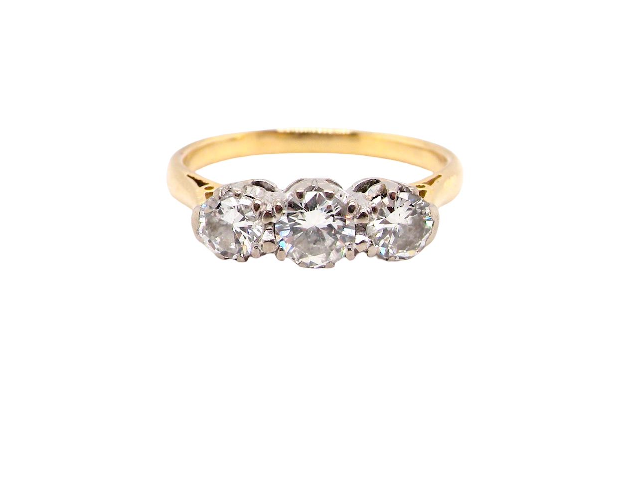 Gold ring with three diamonds on a white background