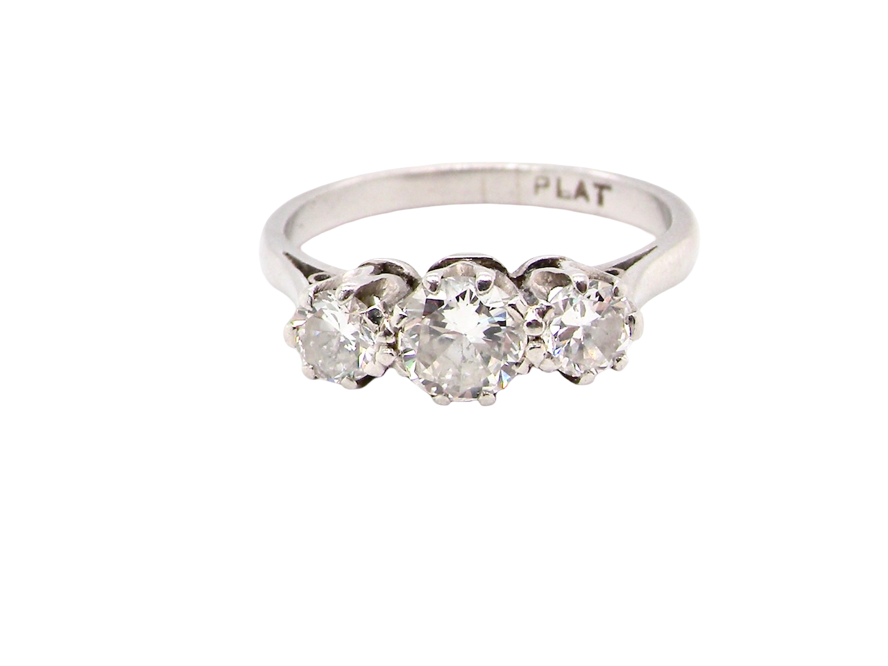 Diamond ring with three stones on a white background