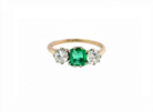 An emerald and diamond trilogy ring