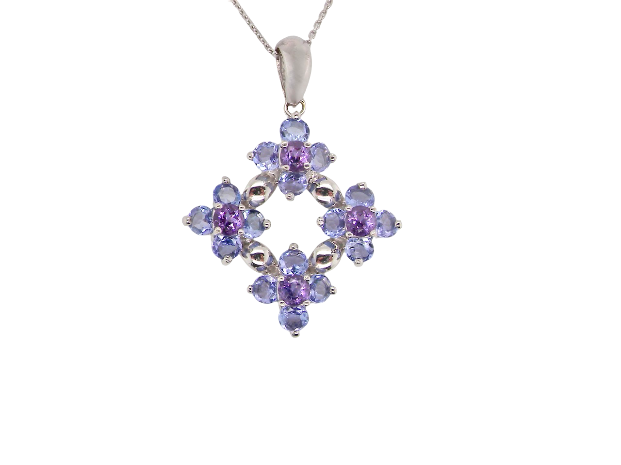 A white gold amethyst and tanzanite pendant