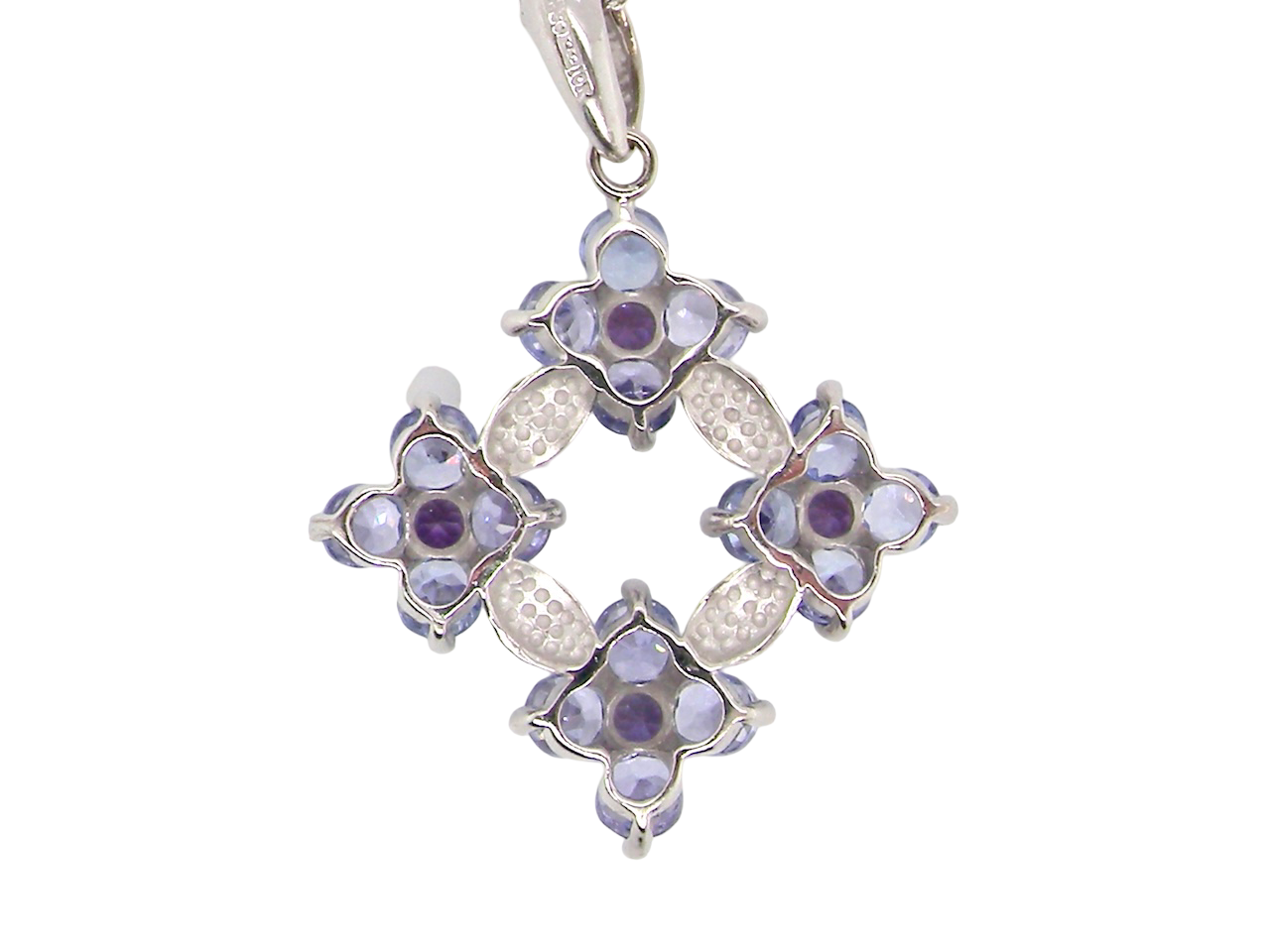 A white gold amethyst and tanzanite pendant