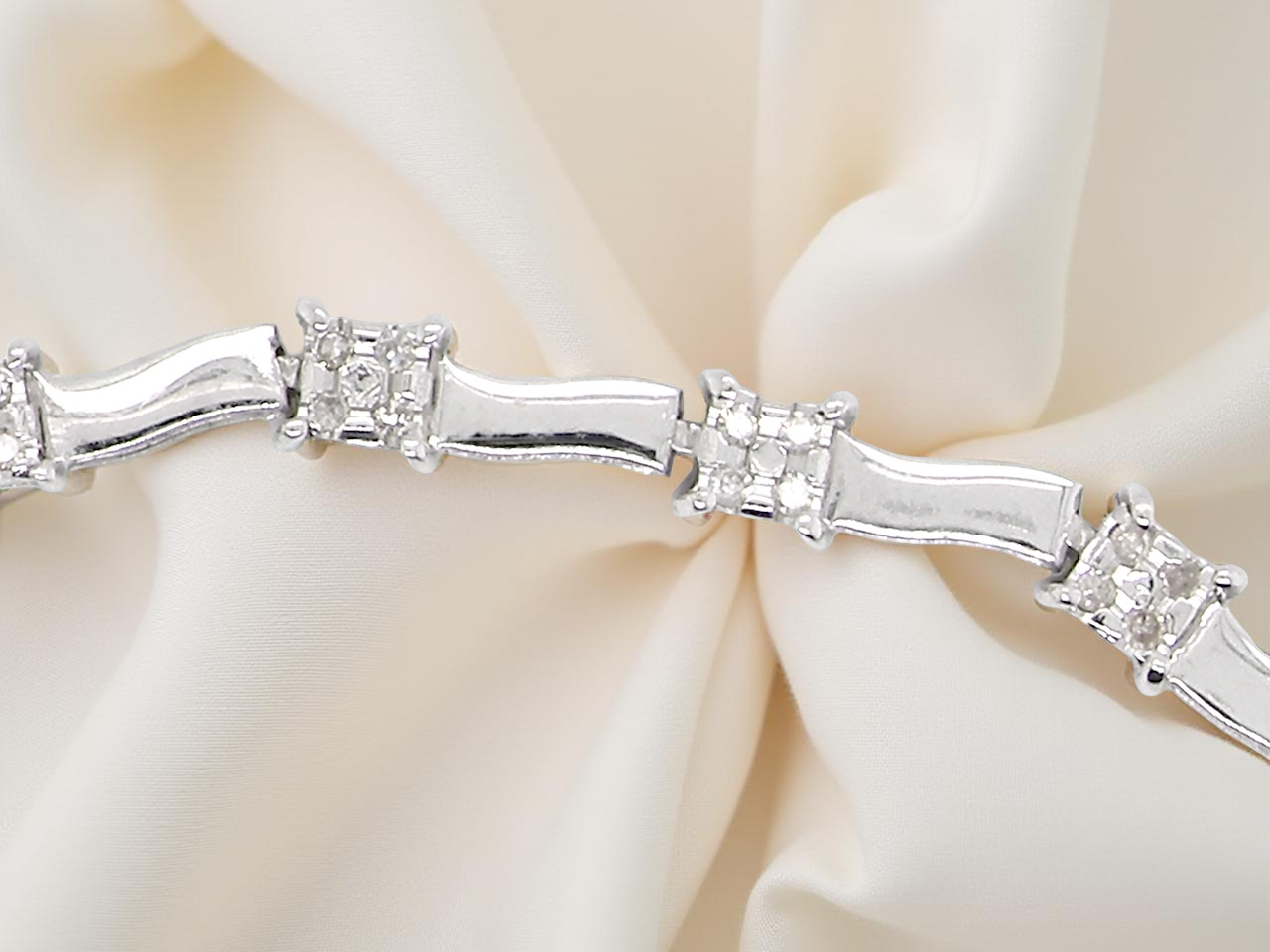 bracelet with diamond accents on a soft beige background