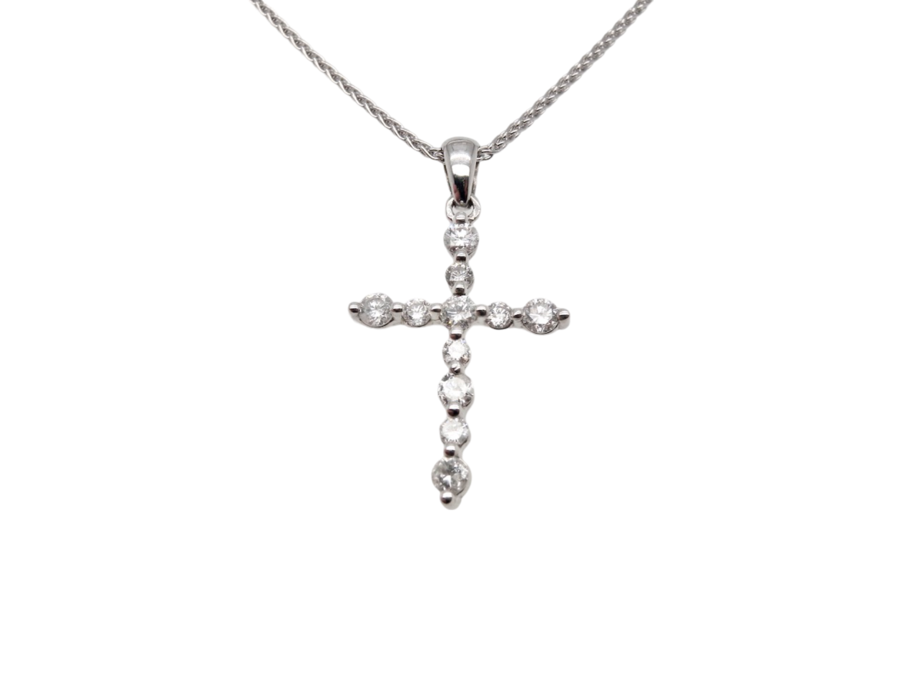 A white gold diamond cross